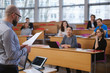 © Nejron Photo - Lecturer and multinational group of students in an auditorium