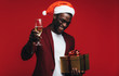 © Jacob Lund - African man enjoying christmas eve