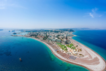 Wall Mural - Aerial birds eye view drone photo of Elli beach on Rhodes city island, Dodecanese, Greece. Panorama with nice sand, lagoon and clear blue water. Famous tourist destination in South Europe