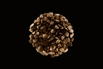 top view of gold stones arranged in circle isolated on black