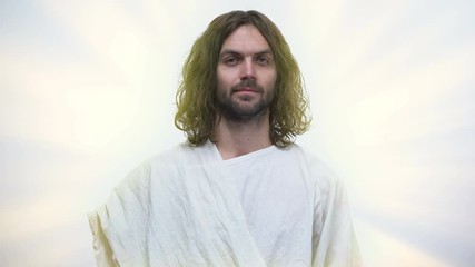 Wall Mural - Jesus with tear-stained eyes looking on camera, forgiving all sins, God mercy