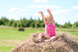 © jordano - baby girl laughing on the summer haystack