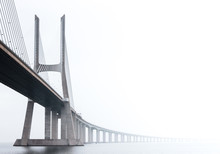 Ponte Vasco Da Gama, Lisbon On A Misty Morning In March. Large Concrete Bridge Across River Tagus, Portugal