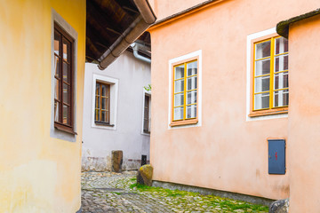 Wall Mural - Narrow cobbled ancient street with picturesque colorful houses, Medieval old town of Tabor, Czech Republic