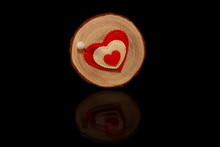 Beautiful Red Heart Is Nailed To A Wooden Saw Cut On A Black Background