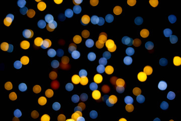 Wall Mural - Background and wallpaper colorful abstract with blurred and bokeh of LED party light bubs reflection on black background.