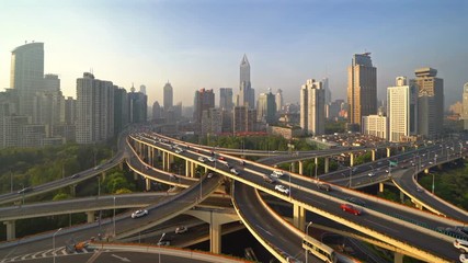 Aufkleber - Highways in Shanghai Downtown, China. Financial district and business centers in smart city in Asia. Top view of skyscraper and high-rise buildings at sunset.
