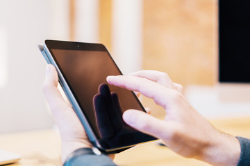 Poster - Sideview of man using tablet