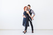 © satura_ - Social dance, kizomba, tango, salsa, people concept - beautiful couple dancing bachata on white background with copy space