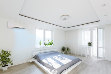 modern bright living room with air conditioning, white wall. 3d rendering