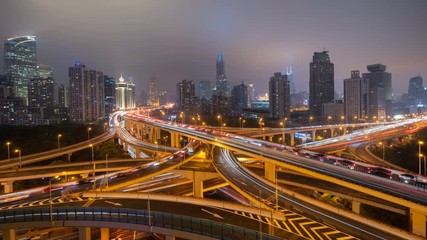 Aufkleber - Time lapse of highways in Shanghai Downtown, China. Financial district and business centers in smart city in Asia. Top view of skyscraper and high-rise buildings at night.