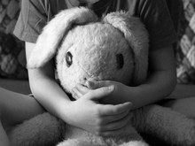 Old Toy Hare In Children's Hands, Black And White