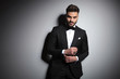 © Viorel Sima - stylish businessman in black tuxedo adjusting his sleeve