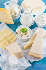 Different types of dairy products on wooden background