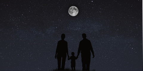 Wall Mural - A very happy family enjoying the starry sky with bright moon.