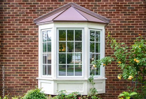 Bay Window With Copper Roof On Traditional Brick Home Flowers Bay Window With Copper Roof On Traditional Brick Home Flowers