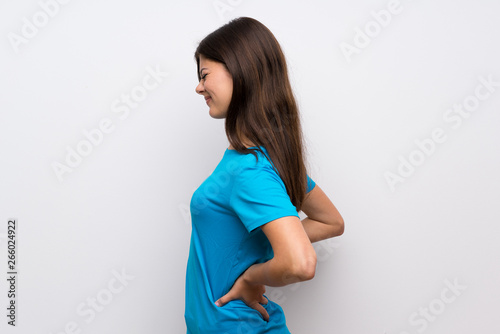 Fotomural Teenager girl with blue shirt suffering from backache for having made an effort