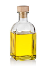 Bottle of yellow oil with wooden cork