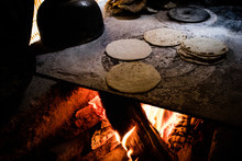 Handmade Corn Tortillas Cooking Over A Traditional Fire In Guatemala