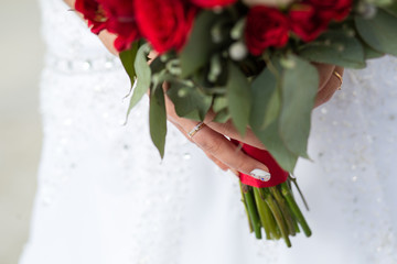 Wall Mural - Wedding bouquet in the hands of the bride