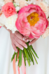 Wall Mural - Wedding bouquet in the hands of the bride