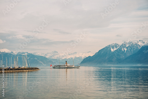 Cuadros en Lienzo Steam boat with French and Swiss flags floating on Lake Geneva, Switzerland
