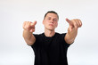 © Kiryl Lis - Body language. Attractive confident man in total black pointing at you.