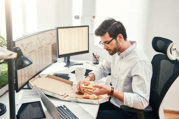 Fototapete - i love pizza! young bearded businessman or trader in eyewear and formal clothes is eating hot pizza 