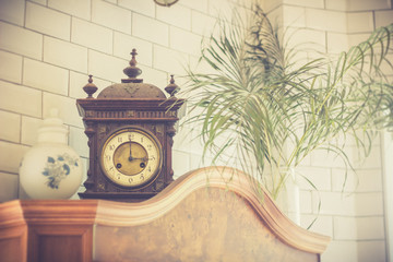 old clock on cabinet. vintage decoration.