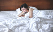 © Space_Cat - Female alcoholism. Alcohol addiction. Drunk depressive woman in bed in the morning feeling horrible and sick
