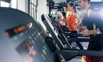 Wall Mural - People exercising on treadmill