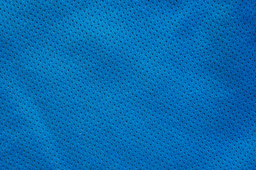 Blue fabric sport clothing football jersey with air mesh texture background