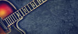Old jazz electro guitar on a dark background. Close up. Copy space. Background for music festivals, concerts. Music background.