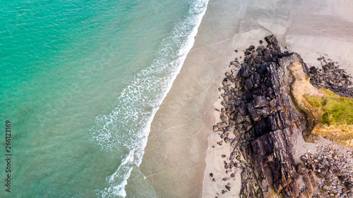 Une Plage Avec Rocher Et Mer Verte Translucide En Vue Aerienne Stock Photo Adobe Stock Une Plage Avec Rocher Et Mer Verte Translucide En Vue Aerienne Stock Photo Adobe Stock