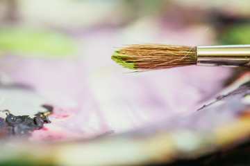 Painting artwork: paint brushes on painting background