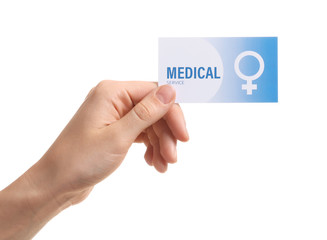 Wall Mural - Girl holding medical business card isolated on white, closeup. Women's health service