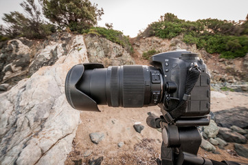 Paralia Gerakinis, Sithonia, Chalkidiki, Greece - June 29, 2014: The camera Nikon D7100 is on a tripod Vanguard Alta PRO and a large tele-lens Sigma 18-250 mm