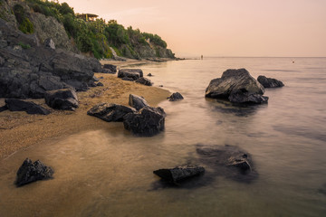 Wall Mural - Paralia Gerakinis, Sithonia, Chalkidiki, Greece - June 29, 2014: Dawn on the beach in the village Paralia Gerakinis on the peninsula Sithonia