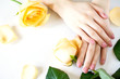 © elena_hramowa - Beautiful manicured woman's nails with pink polish isolated. Nails care. Manicure, pedicure beauty salon. Beautiful rose yellow blossoms.