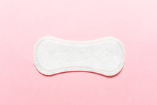 Feminine Hygiene Pad On A Pink Background. Concept Of Feminine Hygiene During Menstruation. Top View.