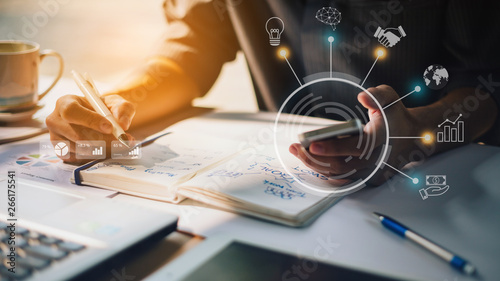 Fotomural Businessman working on project for SWOT analyzing company financial report balance with augmented reality graphics at modern office space