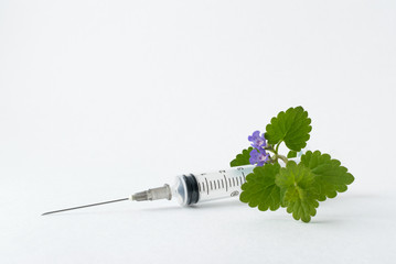 Wall Mural - medical syringe with a long needle for the treatment of diseases and beauty shots on a white background