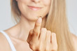 © Olesia - Young woman holding contact lens. Eyewear, eyesight and vision, eye care and health, ophthalmology and optometry concept, selective focus on finger