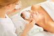 © Studio Romantic - A cosmetologist applies a mask to a woman.
