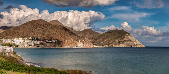 Wall Mural - Panoramic view in the Mediterranean coast of Spain with white town in the distance.