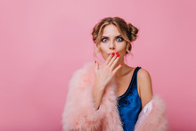 Surprised Pretty Girl With Cute Hairstyle Said Something Wrong, While Posing In Front Of Pink Wall. Adorable Young Woman In Velvet Bodysuit Cover Her Mouth With Hand, Isolated On Bright Background