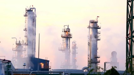 Wall Mural - The vapor of the mist that is distilled from the cooling water to the factory with the oil refinery on morning time