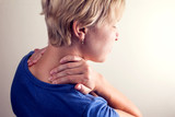 Fototapeta  - Woman feels strong neck pain. People, healthcare and medicine concept