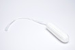 White protect for woman, hygienic tampon close up on white background. Clean concept of health care.