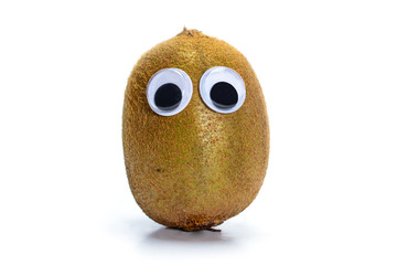 Sad kiwi fruit with googly toy eyes. Whole kiwi fruit isolated on white background.